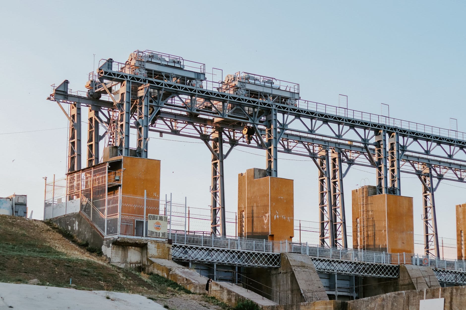 A hydroelectric generating facility seen in flat early light