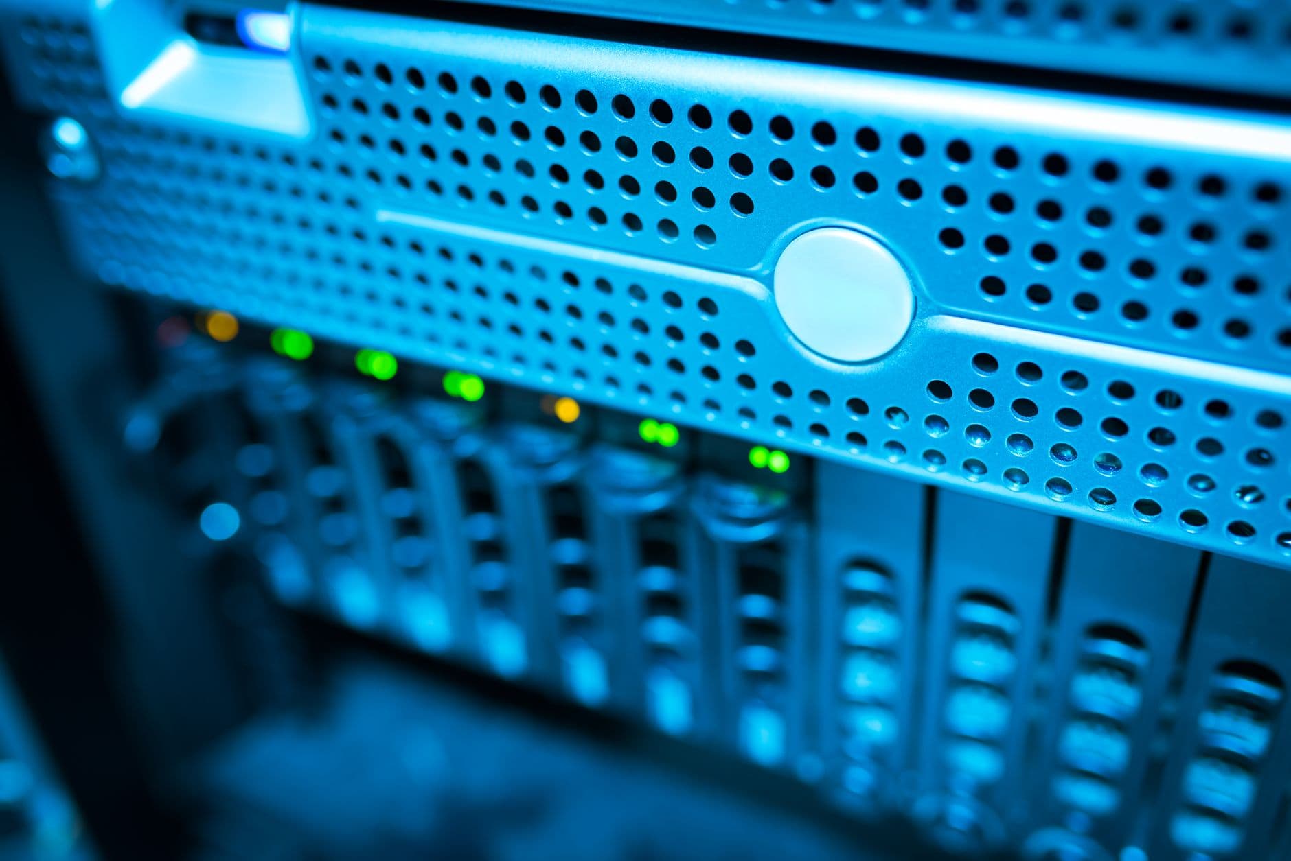 A data centre server rack with status lights, lit blue
